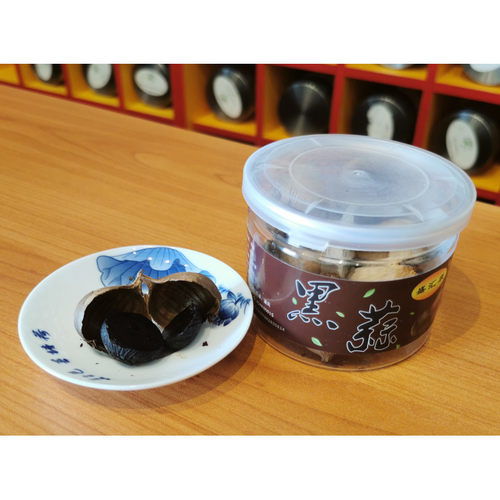 Black garlic cloves in a 100g jar for antioxidant and energy support-opened